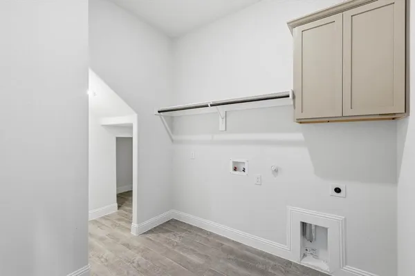 a view of storage and utility room with closet