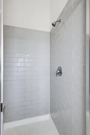 a bathroom with a shower and a bathtub