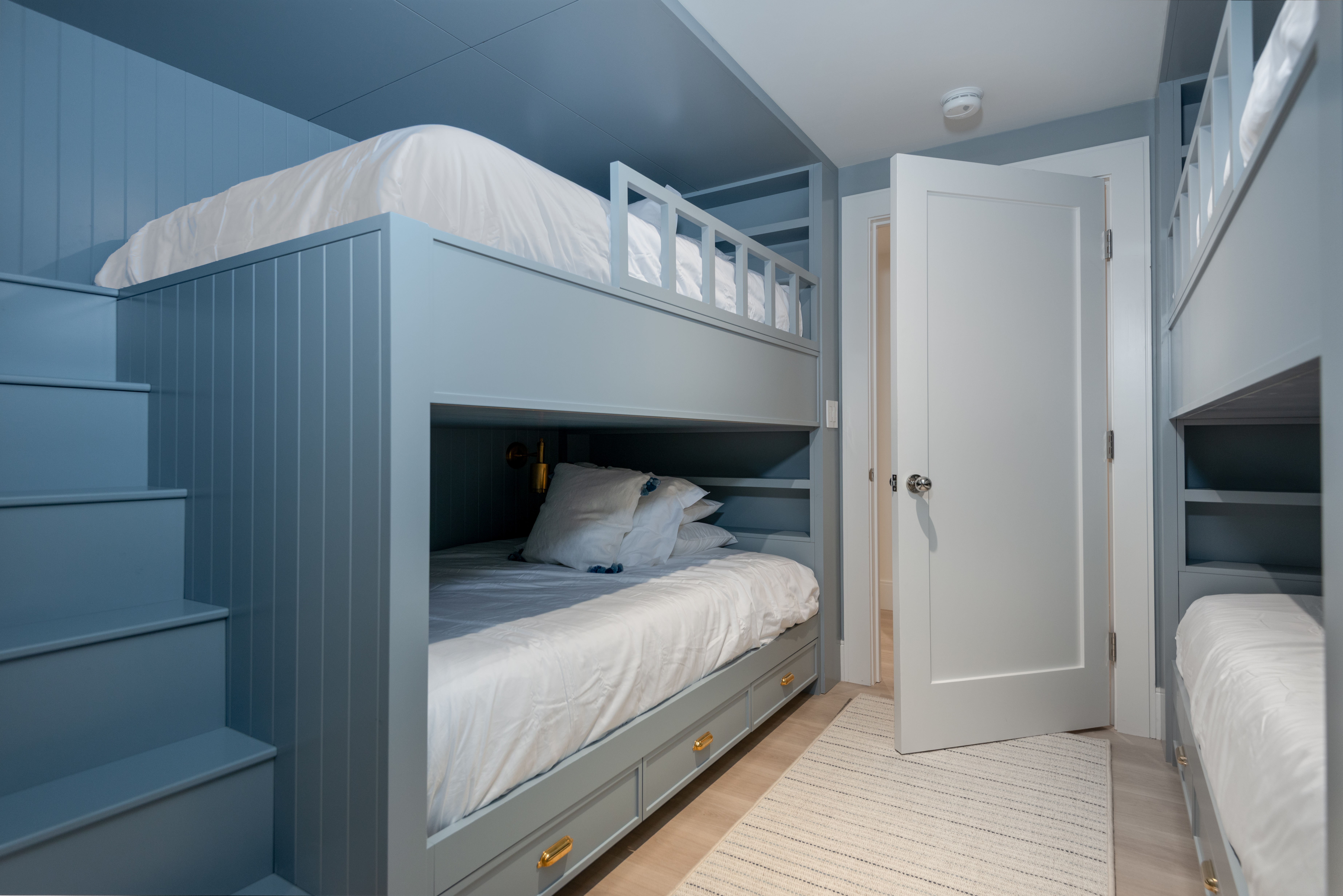 15 Deer Run Road Nantucket, MA 02554 - Photo 40 of 62 a bedroom with a bed and a mirror