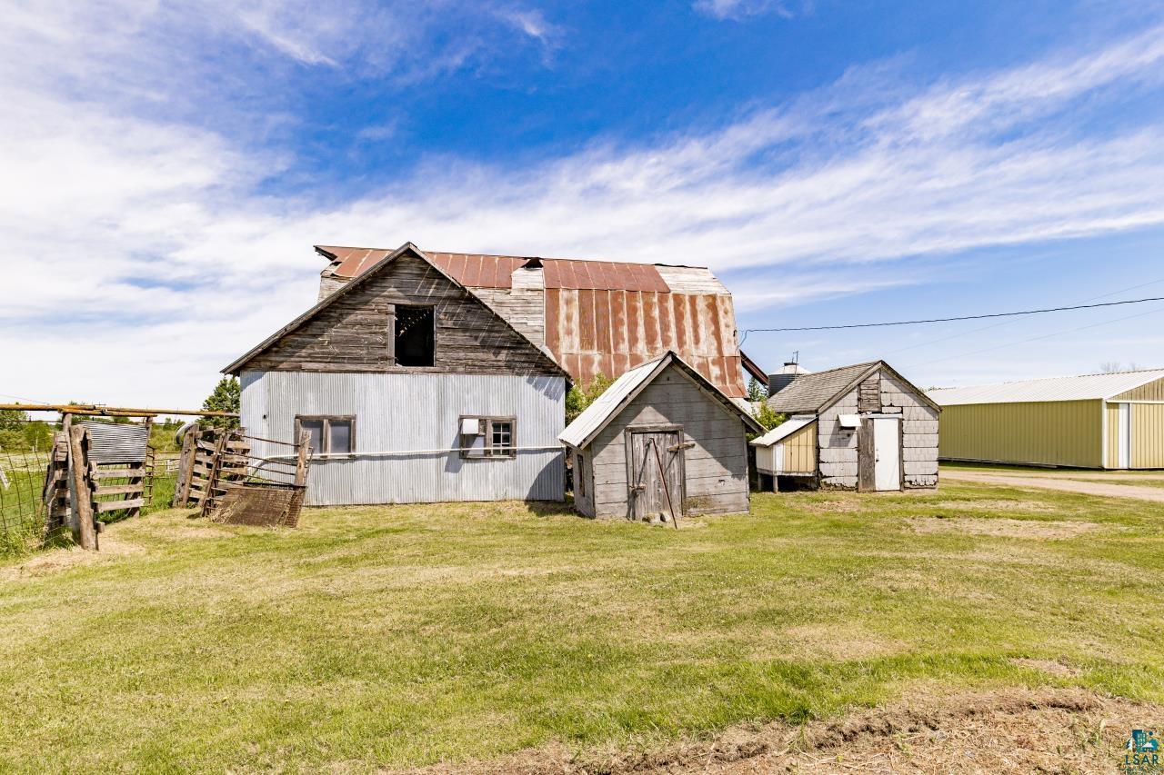 6606 Metso Road Kettle River, MN 55757 - Photo 65 of 84 Farmstead featuring a primary structure with corrugated metal siding and a rustic wood gable