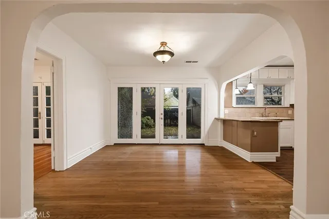 a view of an empty room with glass door