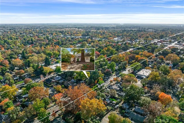 an aerial view of residential building with green space