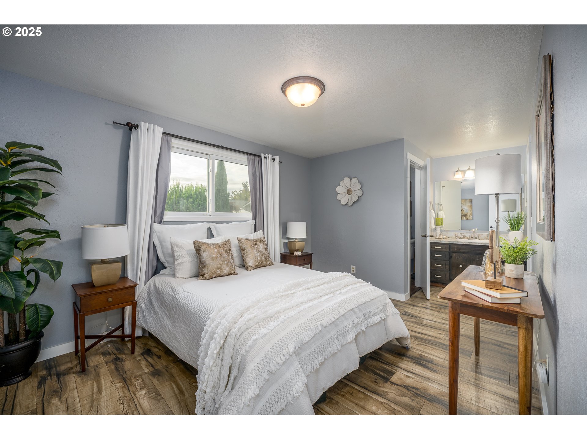 2676 Wheeler Street Southeast Albany, OR 97322 - Photo 12 of 32 a bedroom with a bed and a table