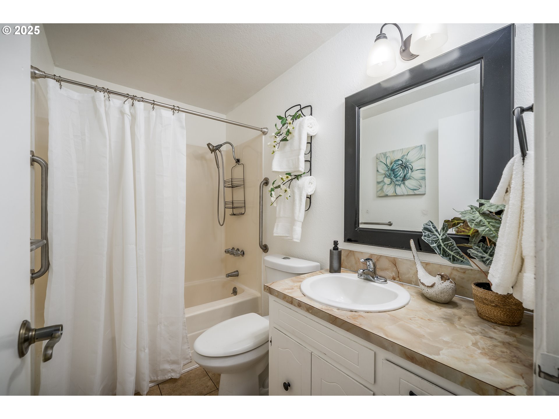 2676 Wheeler Street Southeast Albany, OR 97322 - Photo 17 of 32 a bathroom with a granite countertop sink toilet a mirror a vanity and shower