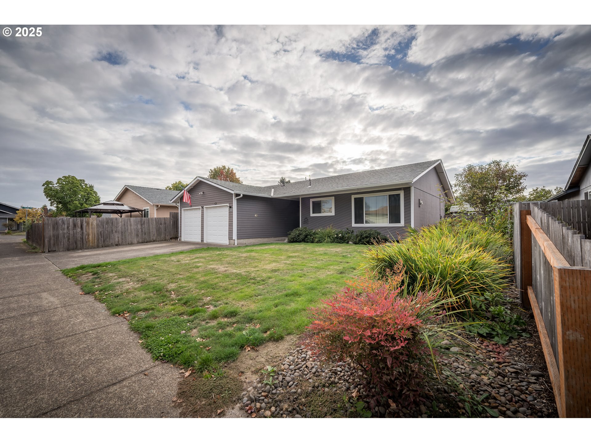 2676 Wheeler Street Southeast Albany, OR 97322 - Photo 2 of 32 a view of a house with backyard and garden