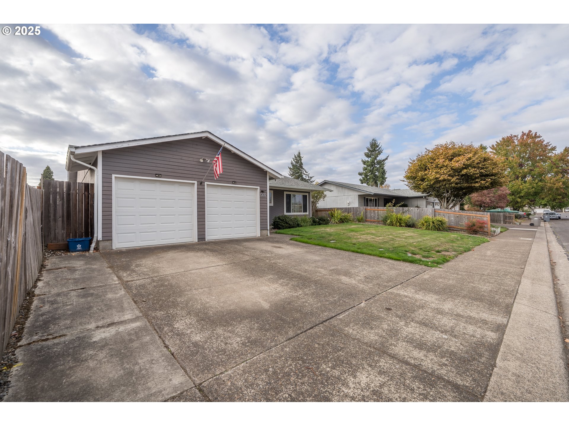2676 Wheeler Street Southeast Albany, OR 97322 - Photo 3 of 32 a view of a house with a yard and garage