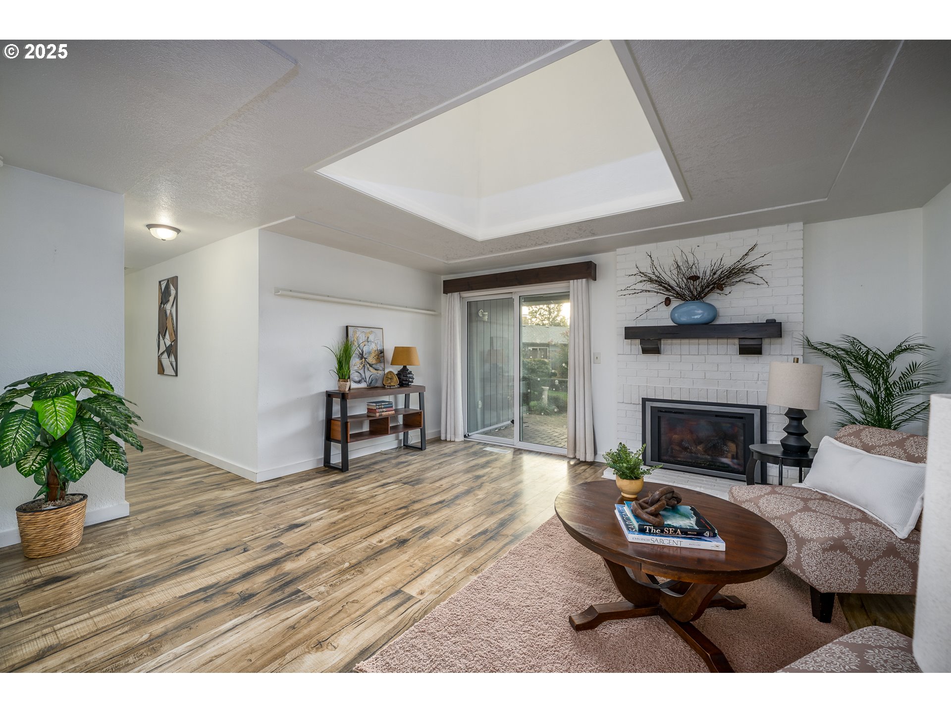 2676 Wheeler Street Southeast Albany, OR 97322 - Photo 7 of 32 a living room with furniture and a fireplace
