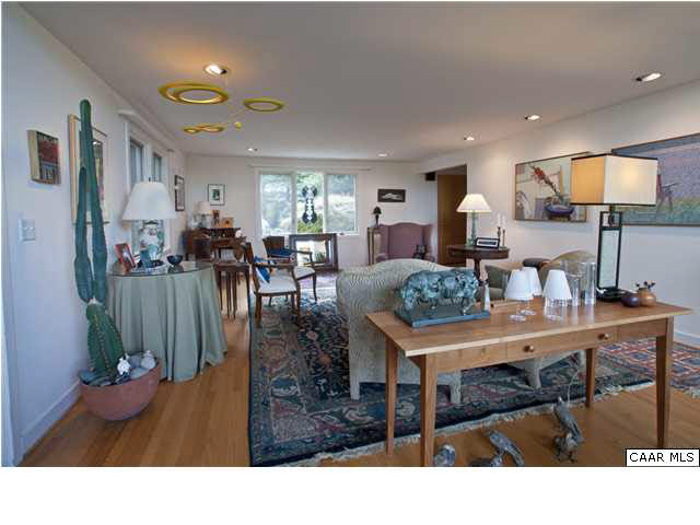 3280 Ridge Road Charlottesville, VA 22901 - Photo 16 of 30 a living room with furniture a chandelier and a flat screen tv