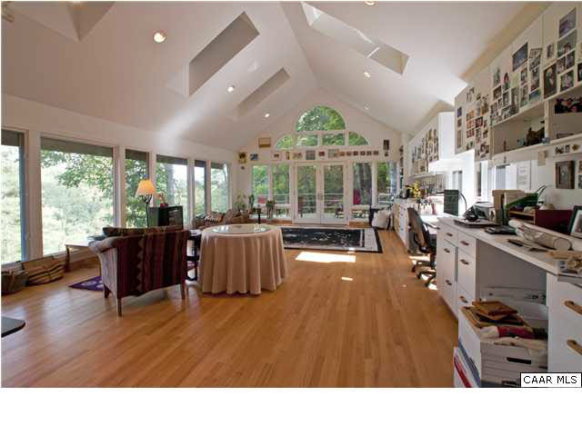 3280 Ridge Road Charlottesville, VA 22901 - Photo 17 of 30 a living room with furniture large window and kitchen view