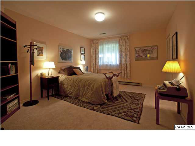 3280 Ridge Road Charlottesville, VA 22901 - Photo 24 of 30 a living room with furniture a lamp and a window