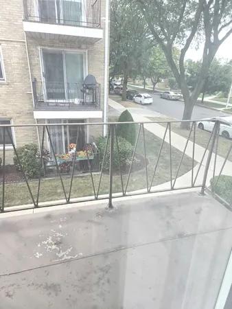 a view of a glass door with a yard