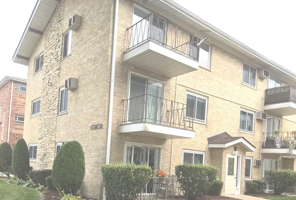 a front view of a multi story residential apartment building