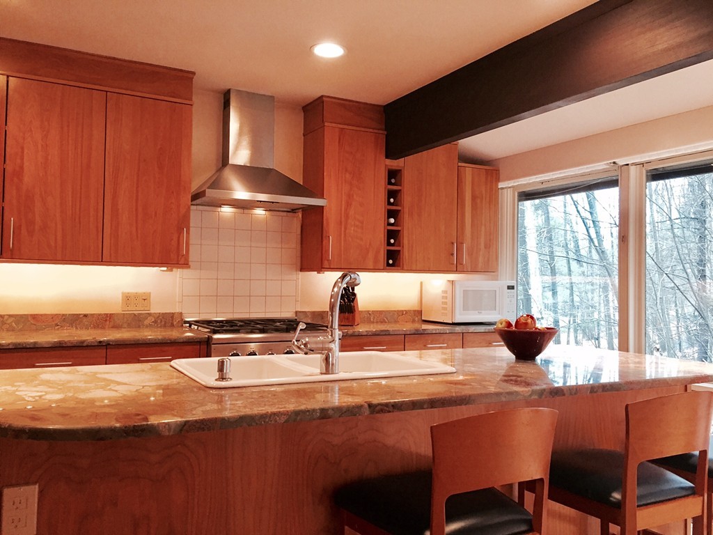 279 Market Hill Road Amherst, MA 01002 - Photo 12 of 30 a kitchen with stainless steel appliances granite countertop a sink and a stove