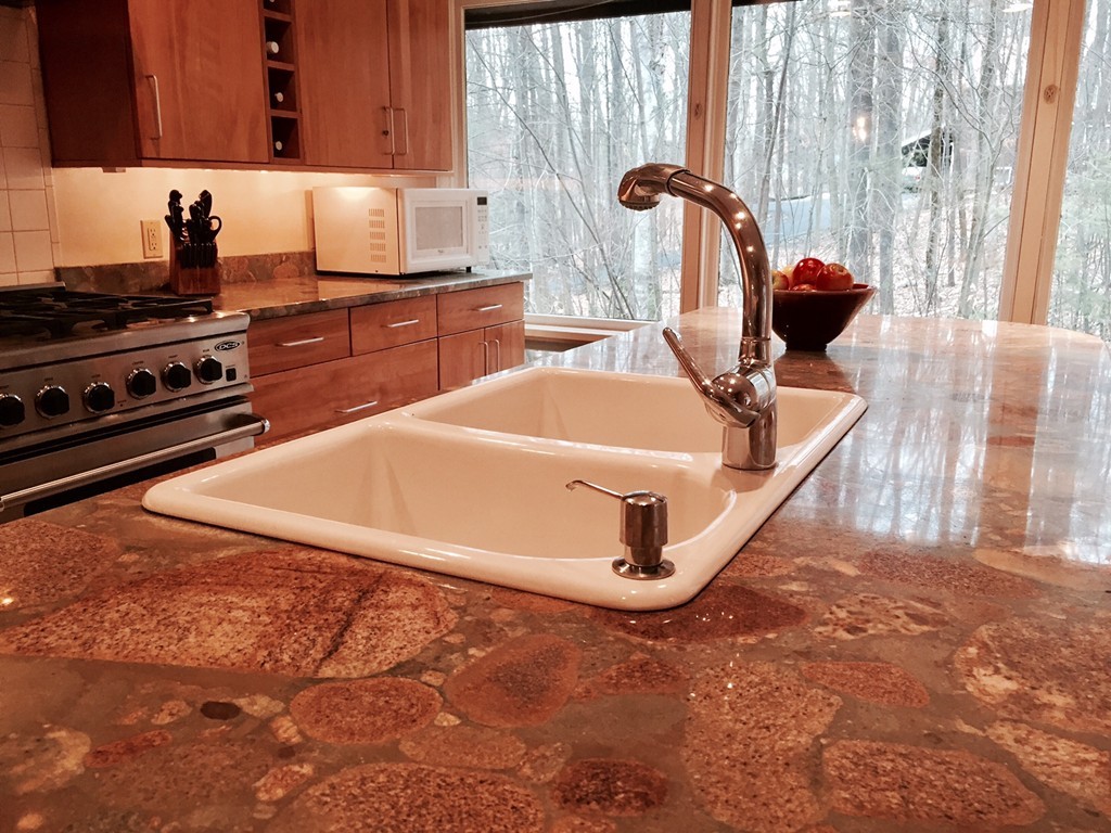 279 Market Hill Road Amherst, MA 01002 - Photo 13 of 30 a kitchen with a sink a stove and cabinets