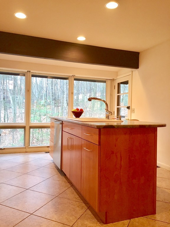 279 Market Hill Road Amherst, MA 01002 - Photo 14 of 30 a kitchen with stainless steel appliances a sink and cabinets