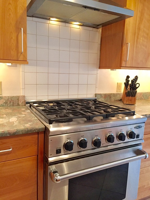 279 Market Hill Road Amherst, MA 01002 - Photo 15 of 30 a stove sitting inside of a kitchen with granite countertop
