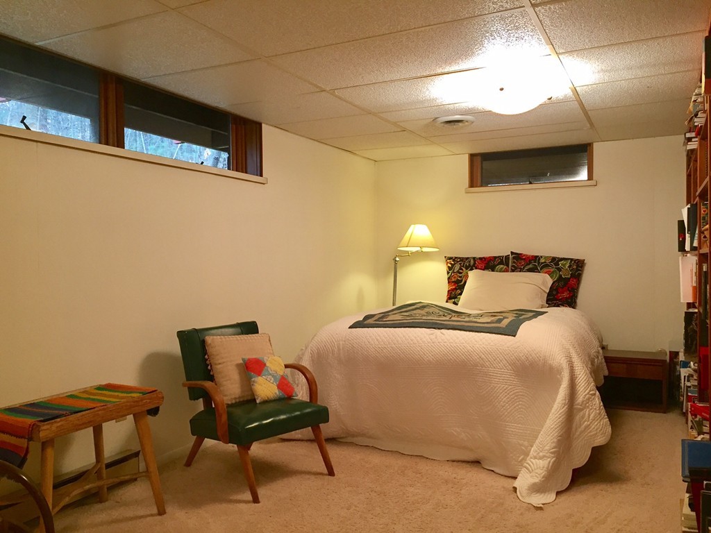 279 Market Hill Road Amherst, MA 01002 - Photo 27 of 30 a bedroom with a bed and chair