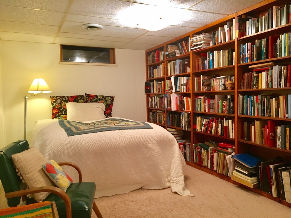 279 Market Hill Road Amherst, MA 01002 - Photo 28 of 30 a bedroom with a bed and a book shelf