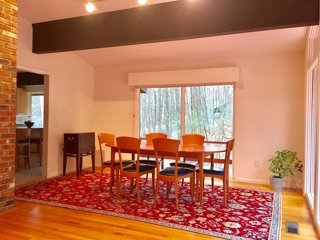 279 Market Hill Road Amherst, MA 01002 - Photo 9 of 30 a view of a dining room with furniture window and wooden floor