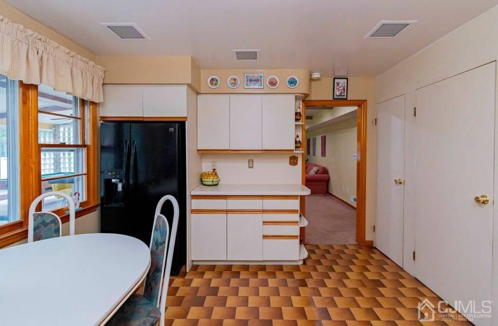 11 Hilltop Road Edison, NJ 08820 - Photo 13 of 30 a room with furniture a flat screen tv and a window
