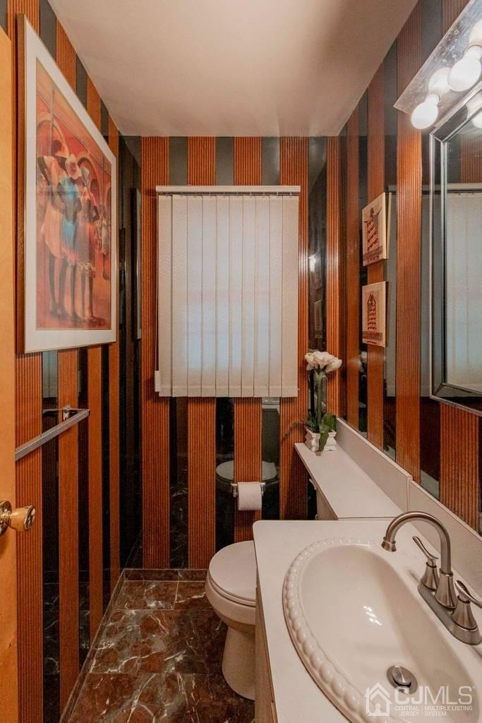11 Hilltop Road Edison, NJ 08820 - Photo 15 of 30 a bathroom with a sink a toilet and shower curtain