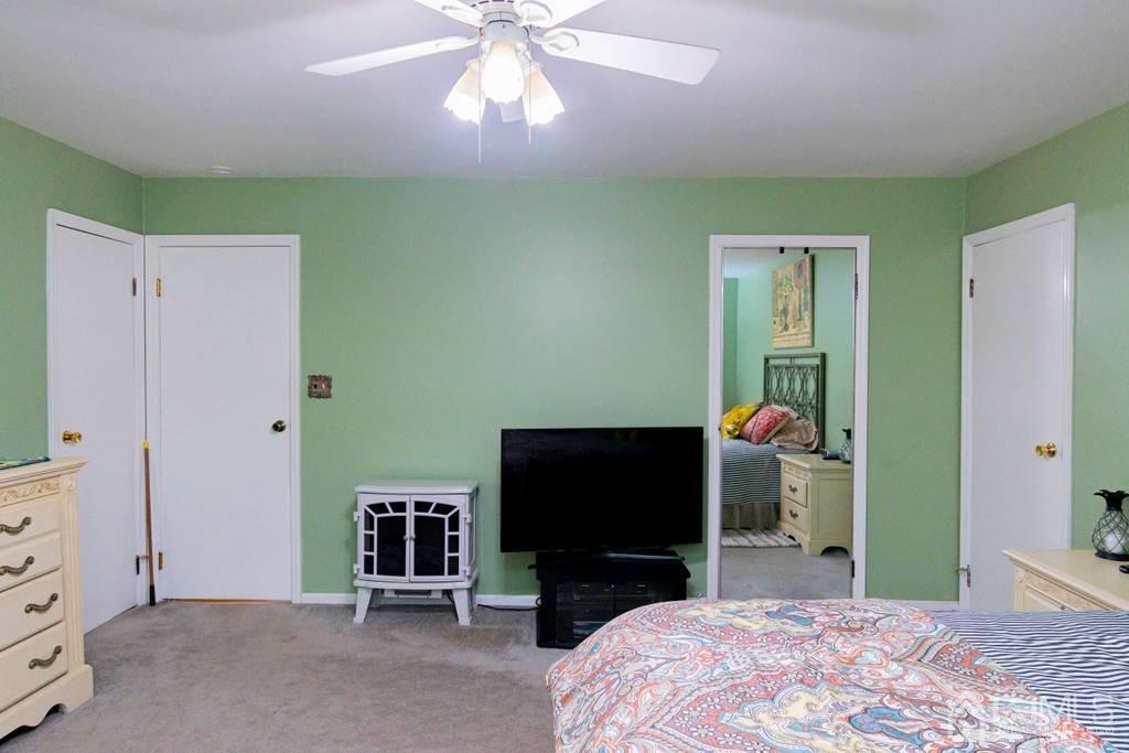 11 Hilltop Road Edison, NJ 08820 - Photo 17 of 30 a bedroom with a bed and a television