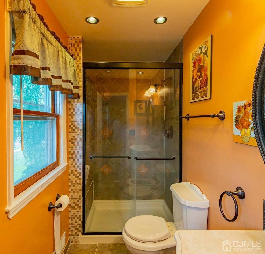 11 Hilltop Road Edison, NJ 08820 - Photo 18 of 30 a bathroom with a shower toilet and sink
