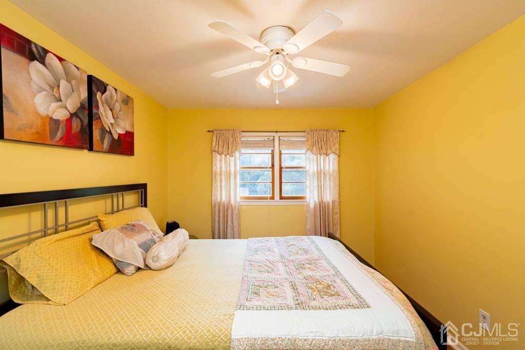 11 Hilltop Road Edison, NJ 08820 - Photo 20 of 30 a bedroom with a bed and a window