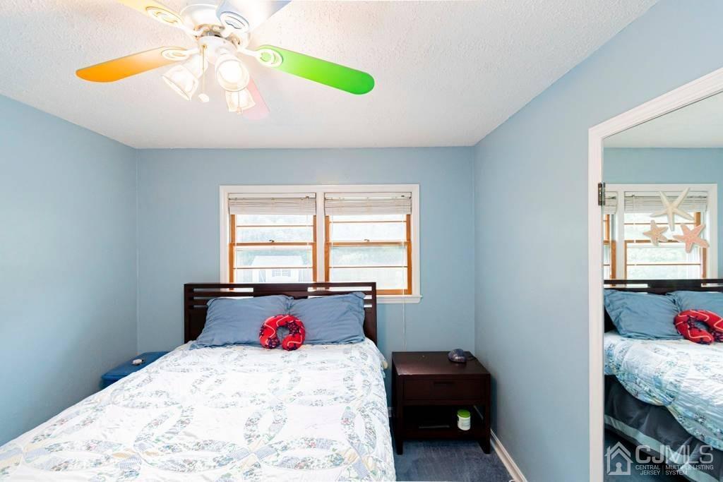 11 Hilltop Road Edison, NJ 08820 - Photo 22 of 30 a bedroom with a bed and a window