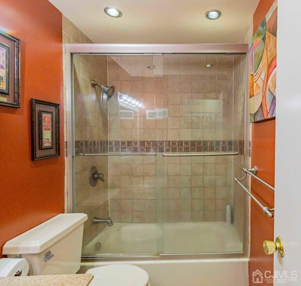 11 Hilltop Road Edison, NJ 08820 - Photo 25 of 30 a bathroom with a bathtub and a shower