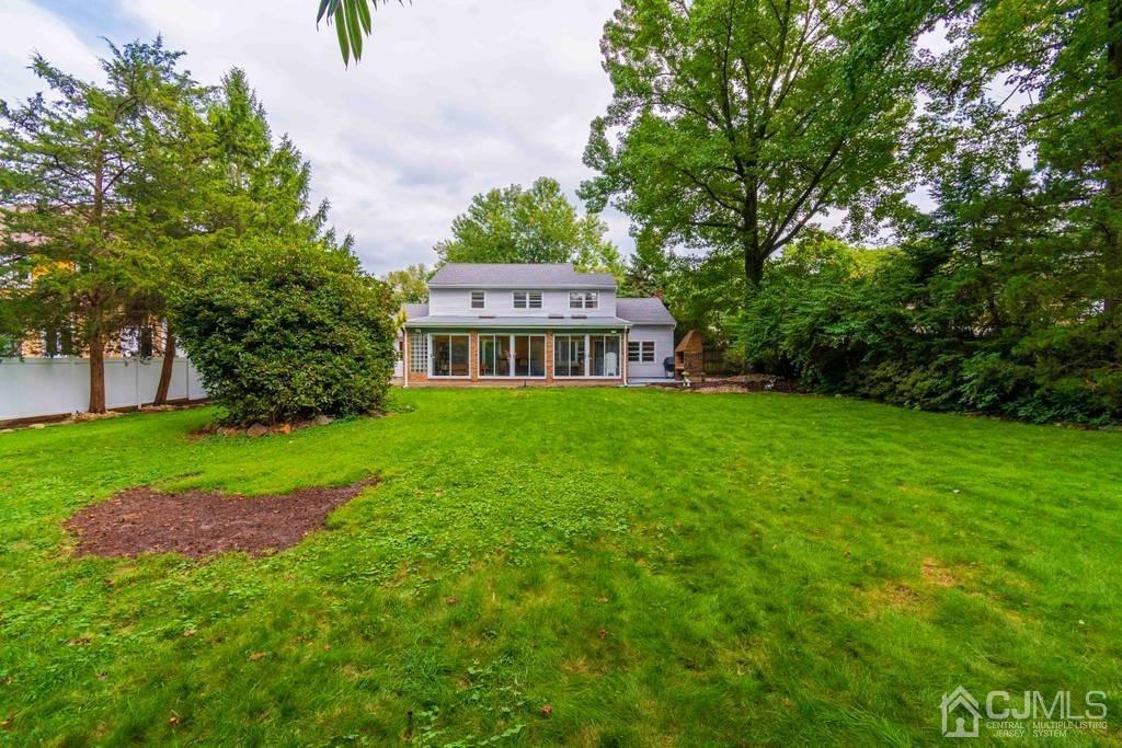 11 Hilltop Road Edison, NJ 08820 - Photo 28 of 30 a view of house with backyard and a garden