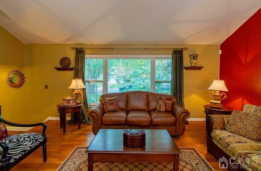 11 Hilltop Road Edison, NJ 08820 - Photo 4 of 30 a living room with furniture and a floor to ceiling window