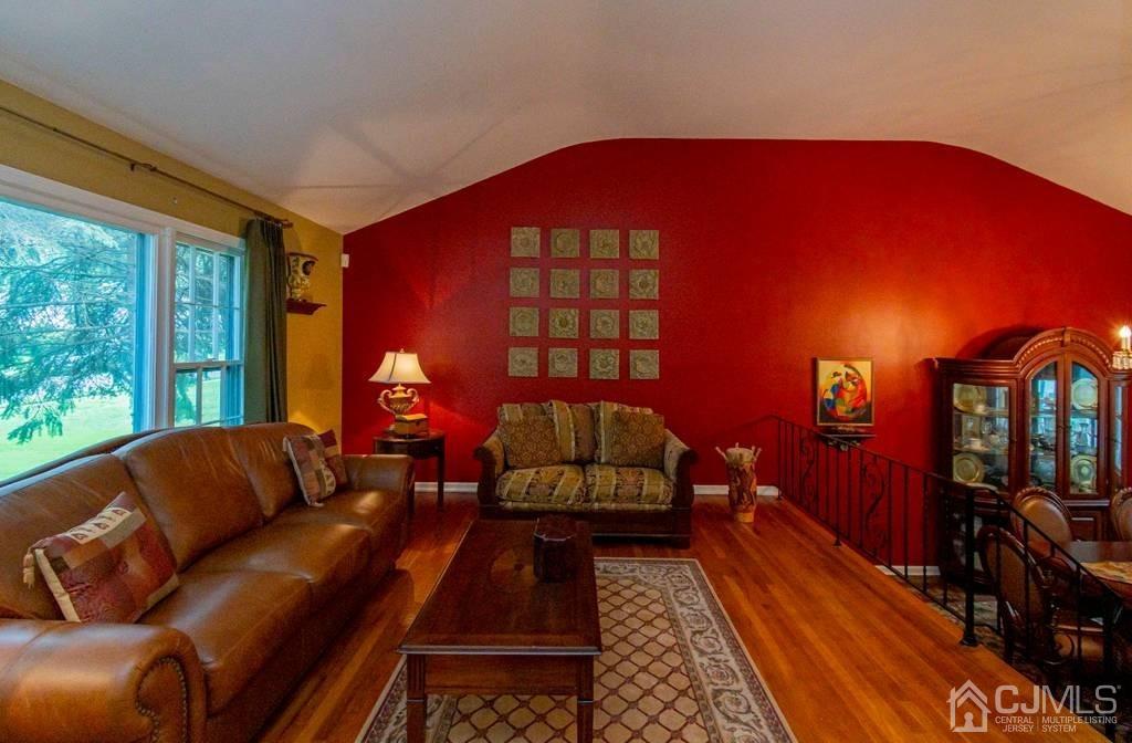 11 Hilltop Road Edison, NJ 08820 - Photo 6 of 30 a living room with furniture and a lamp