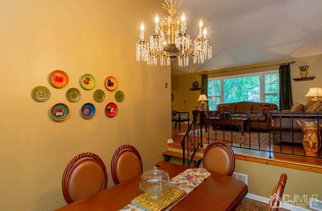 11 Hilltop Road Edison, NJ 08820 - Photo 7 of 30 a view of a dining room with furniture and chandelier