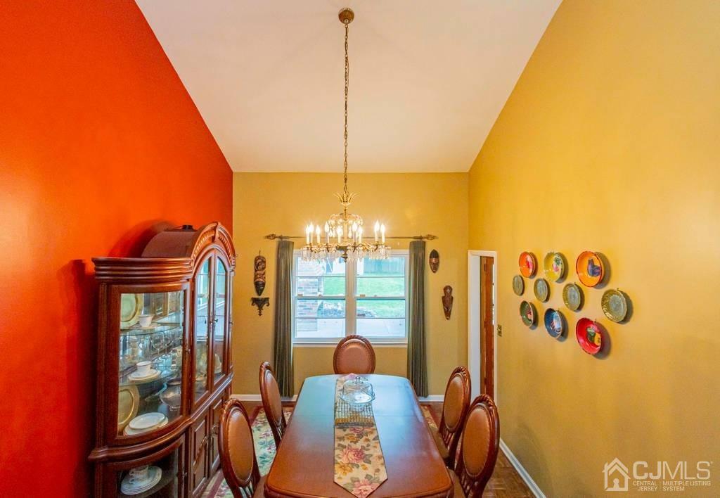 11 Hilltop Road Edison, NJ 08820 - Photo 8 of 30 a view of a dining room with furniture and chandelier