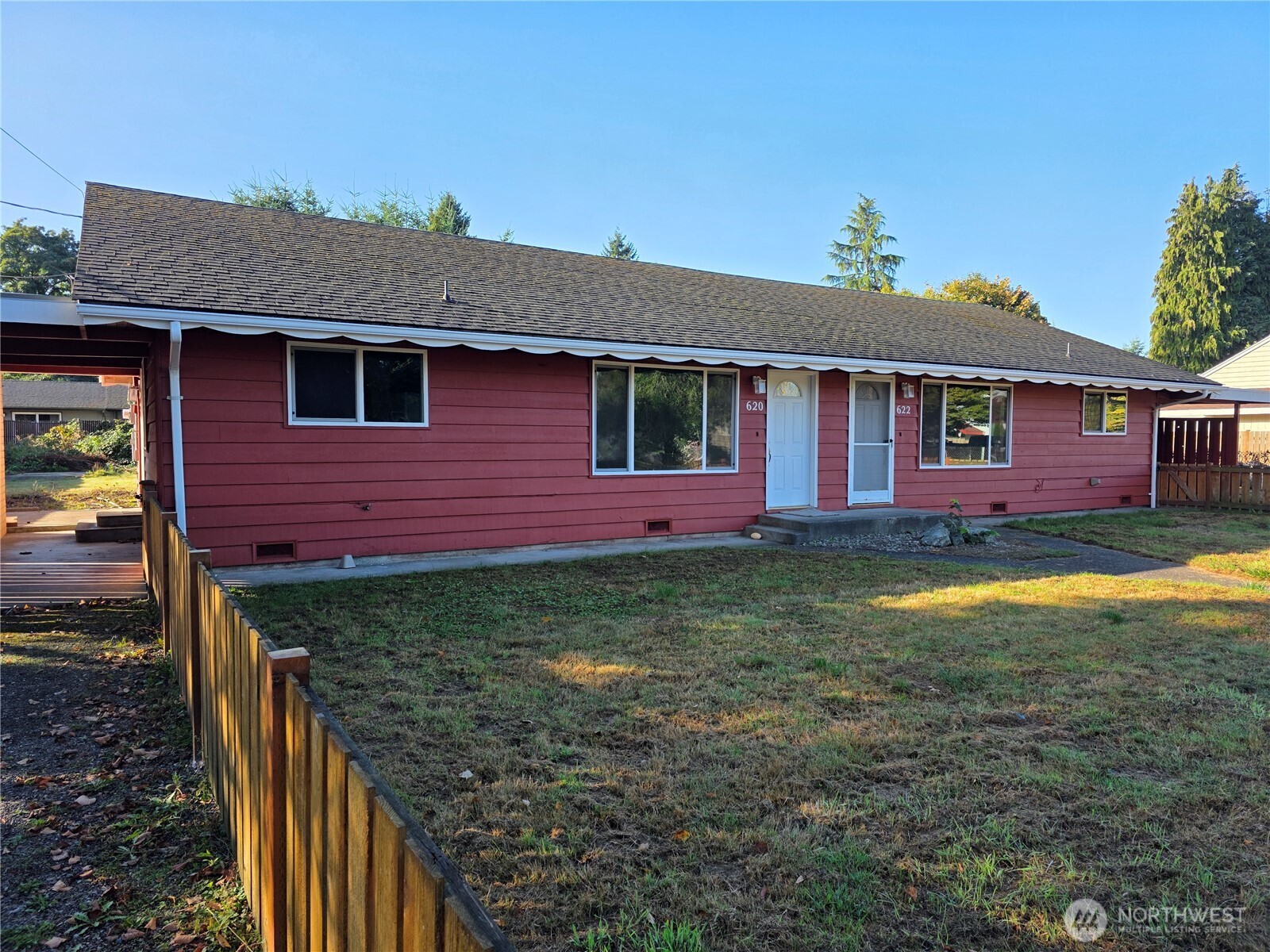 a view of a house with a yard