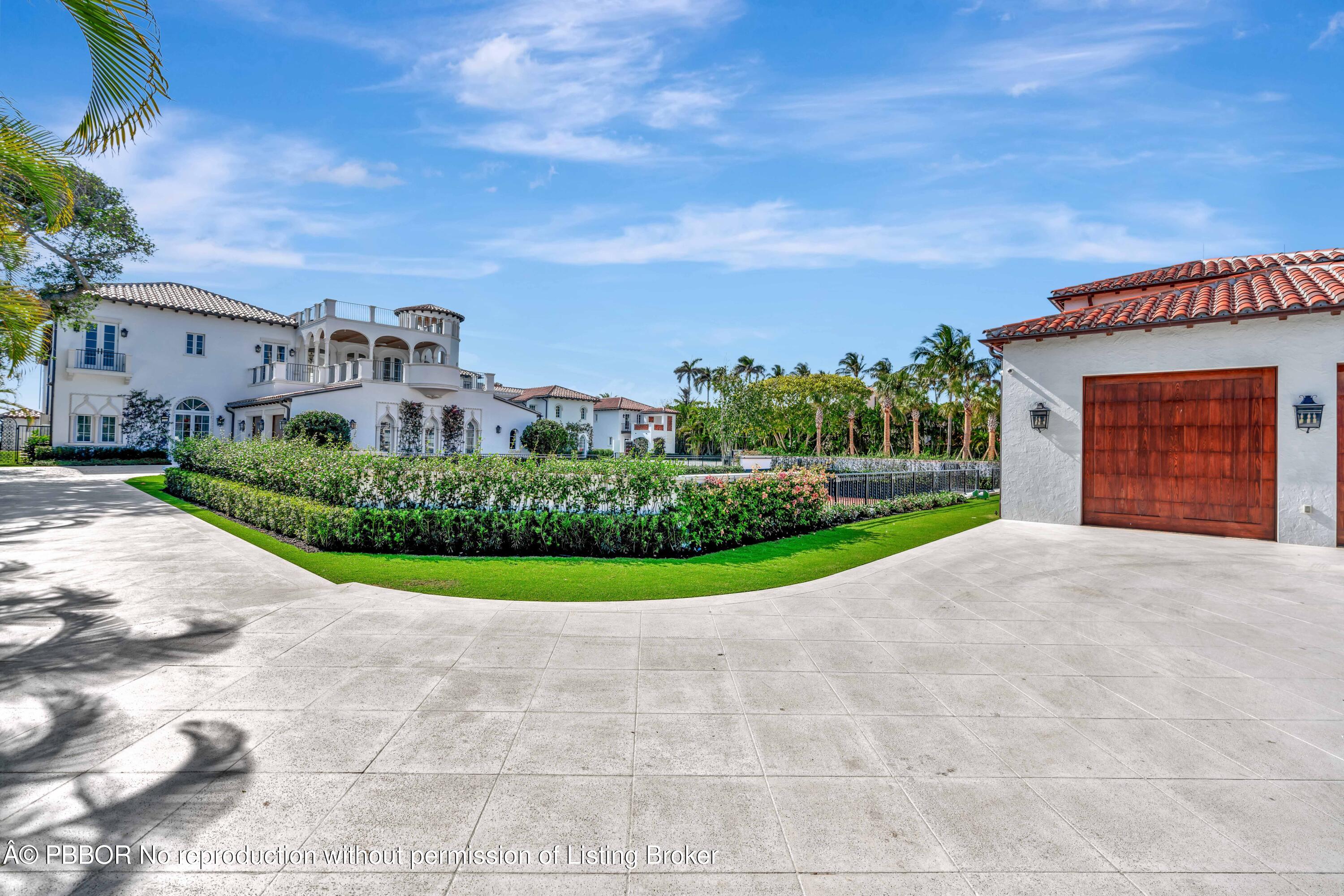 800 South County Road Palm Beach, FL 33480 - Photo 67 of 76 a view of a big house with a big yard and large tree