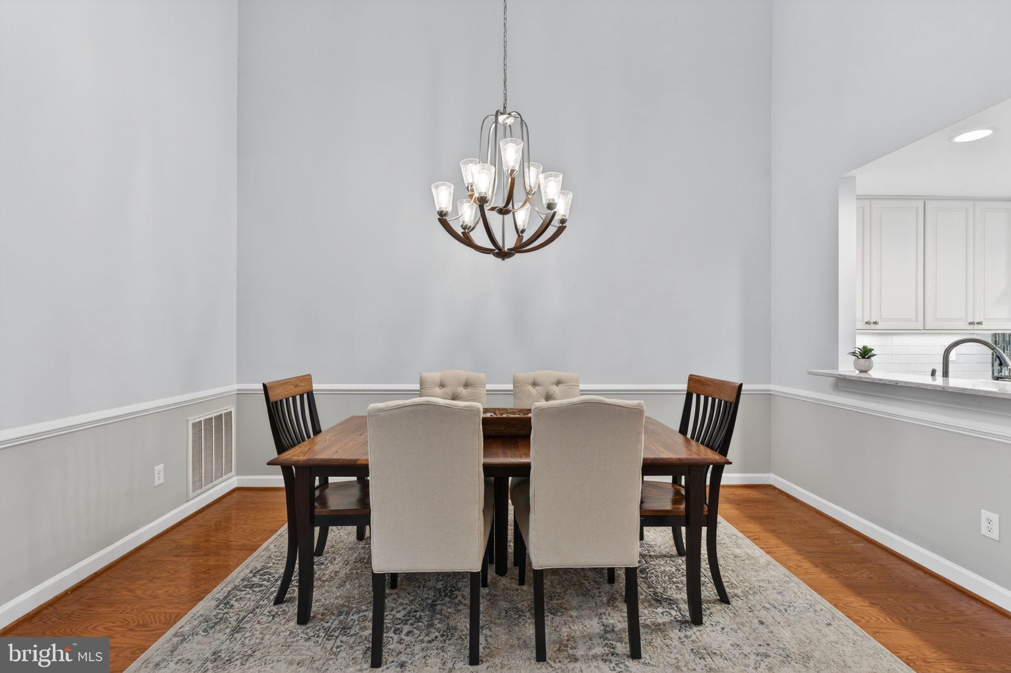 336 Colony Point Place Edgewater, MD 21037 - Photo 11 of 40 a view of a dining room with a table and chairs