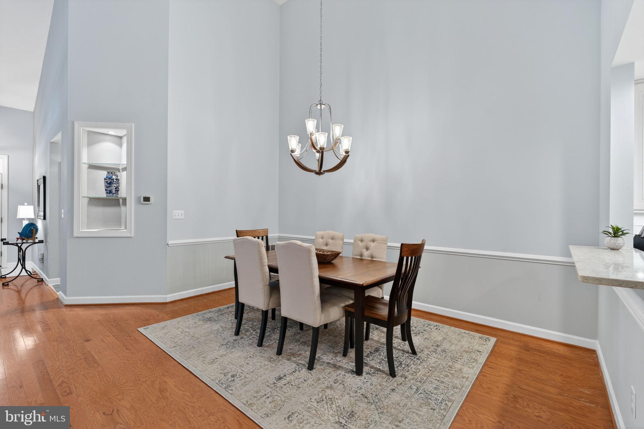 336 Colony Point Place Edgewater, MD 21037 - Photo 12 of 40 a view of a dining room with furniture and wooden floor