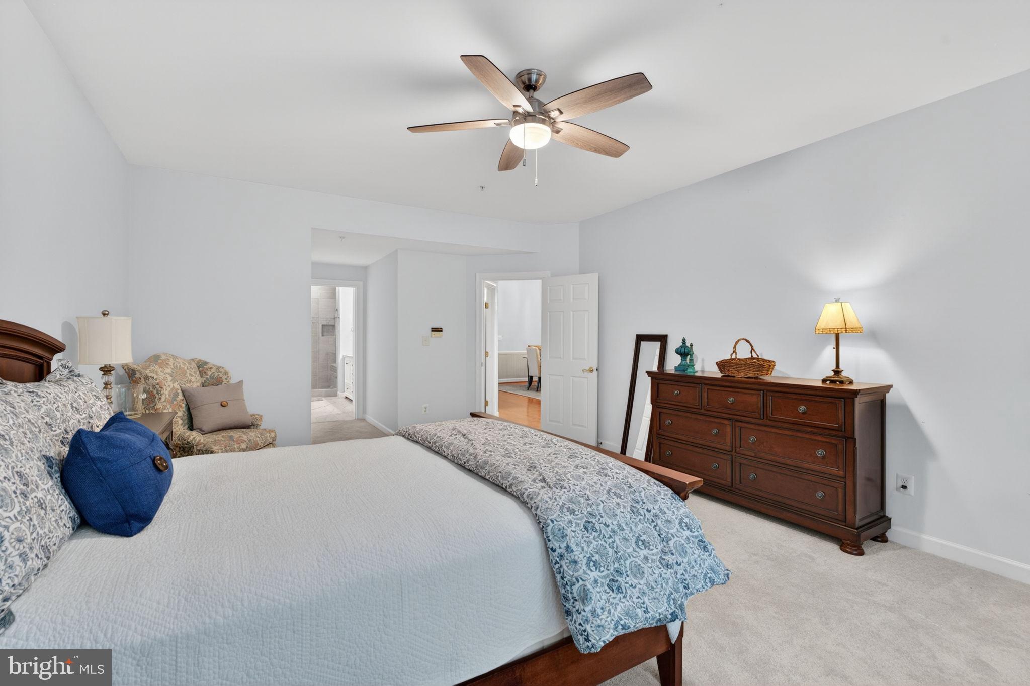 336 Colony Point Place Edgewater, MD 21037 - Photo 22 of 40 a bedroom with a bed and a ceiling fan