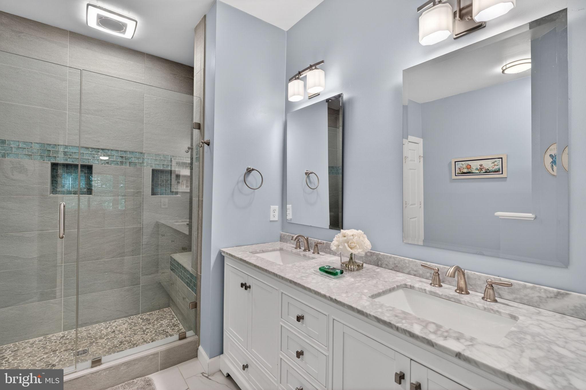 336 Colony Point Place Edgewater, MD 21037 - Photo 27 of 40 a bathroom with a granite countertop sink mirror and shower