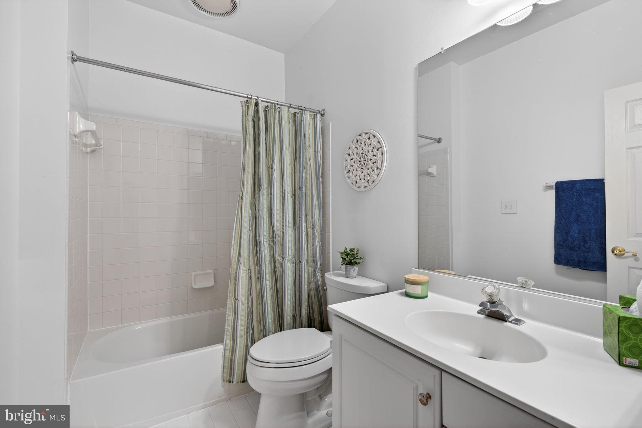 336 Colony Point Place Edgewater, MD 21037 - Photo 32 of 40 a bathroom with a sink toilet and shower