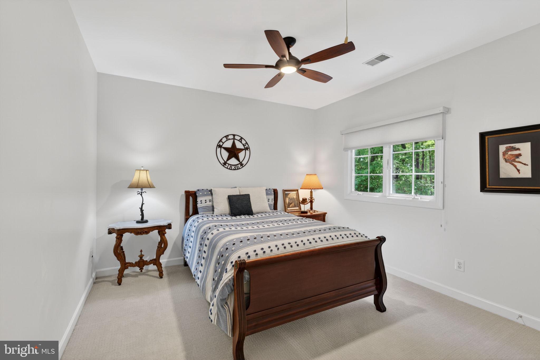 336 Colony Point Place Edgewater, MD 21037 - Photo 35 of 40 a bedroom with a bed and a window
