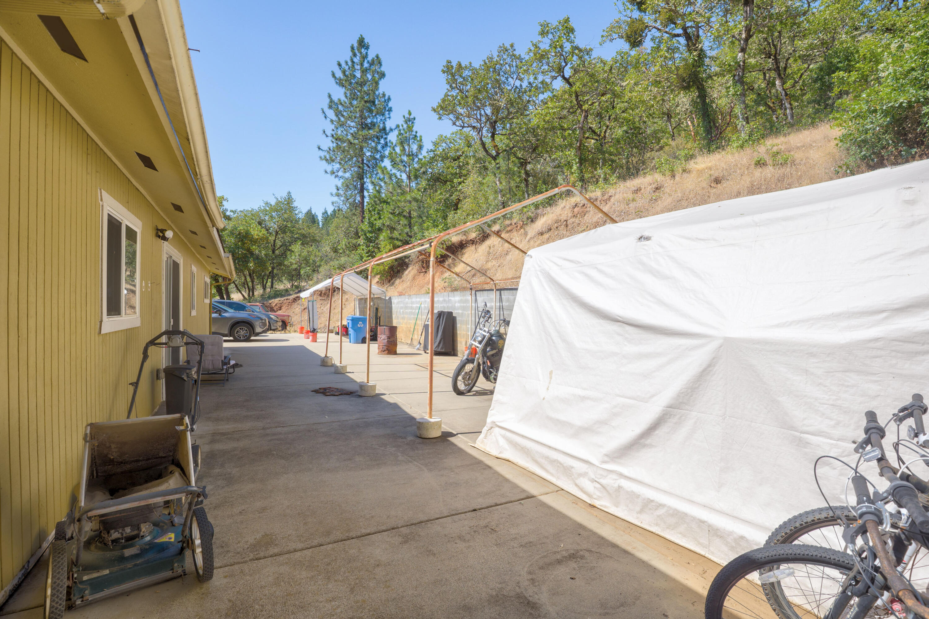 12748 Water Gap Road Williams, OR 97544 - Photo 22 of 35 a view of a house with backyard and sitting area
