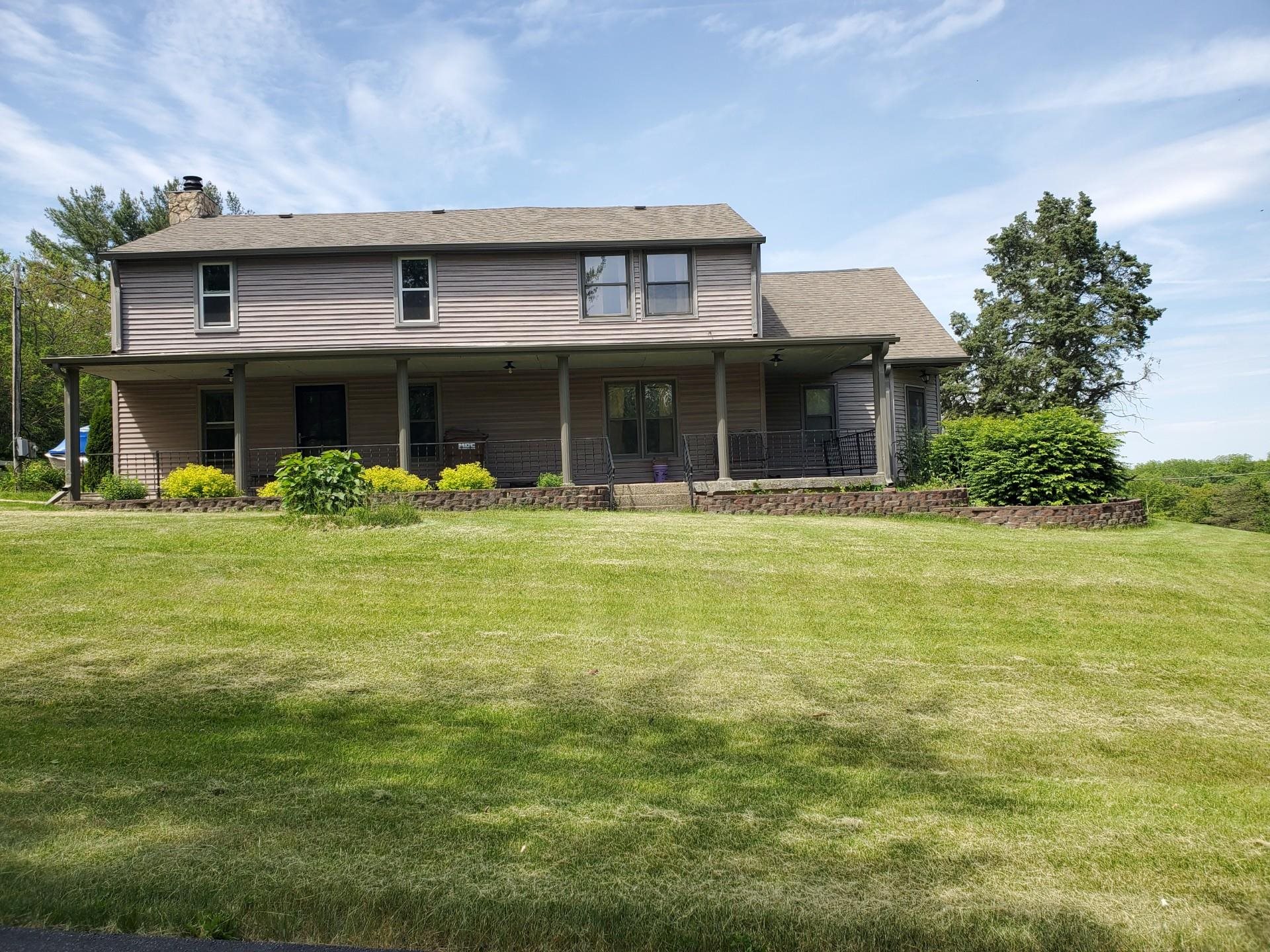 17850 Caledonia Road Caledonia, IL 61011 - Photo 1 of 20 a front view of house with an outdoor space and seating