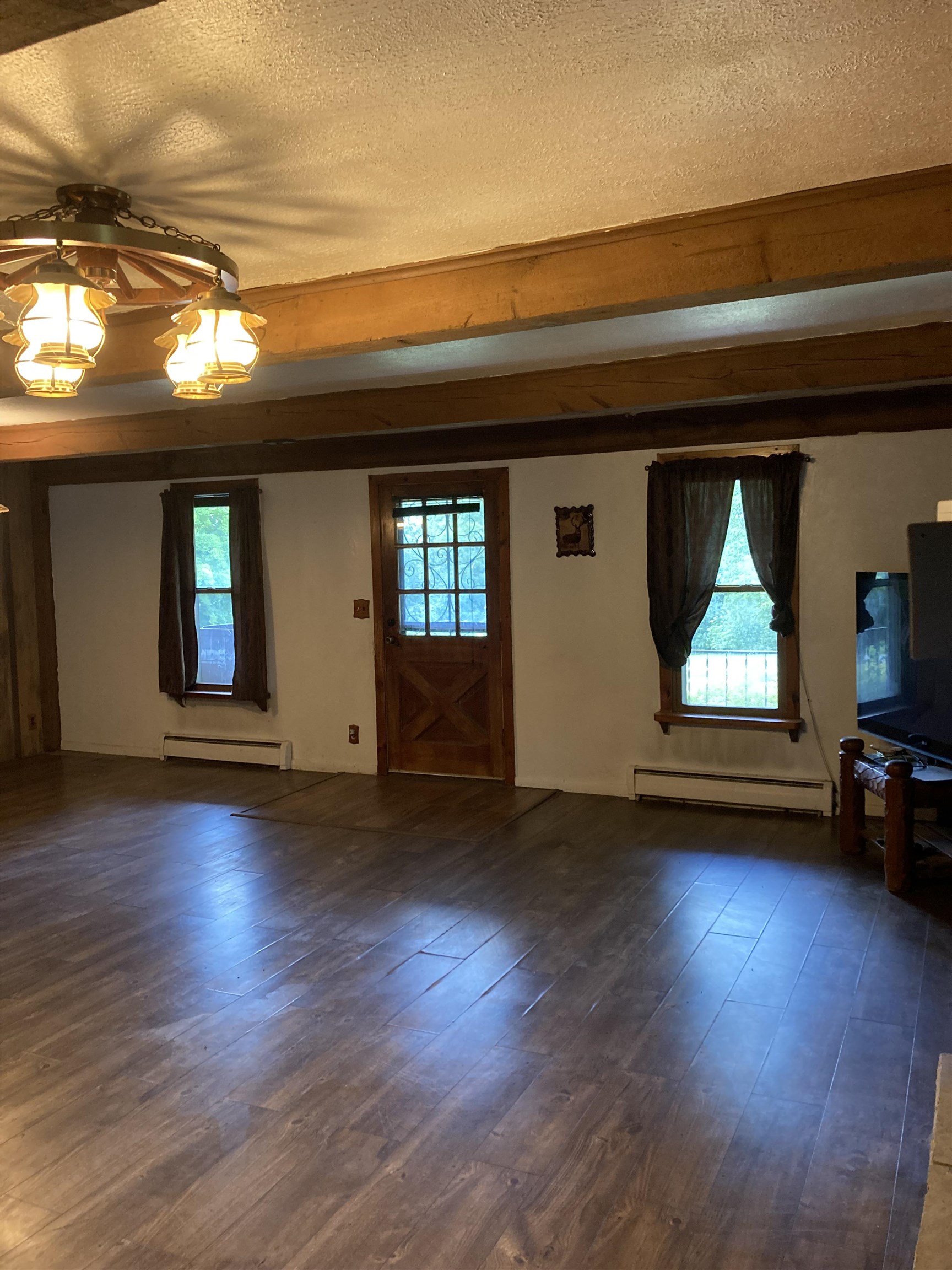 17850 Caledonia Road Caledonia, IL 61011 - Photo 13 of 20 a view of empty room with wooden floor and fan