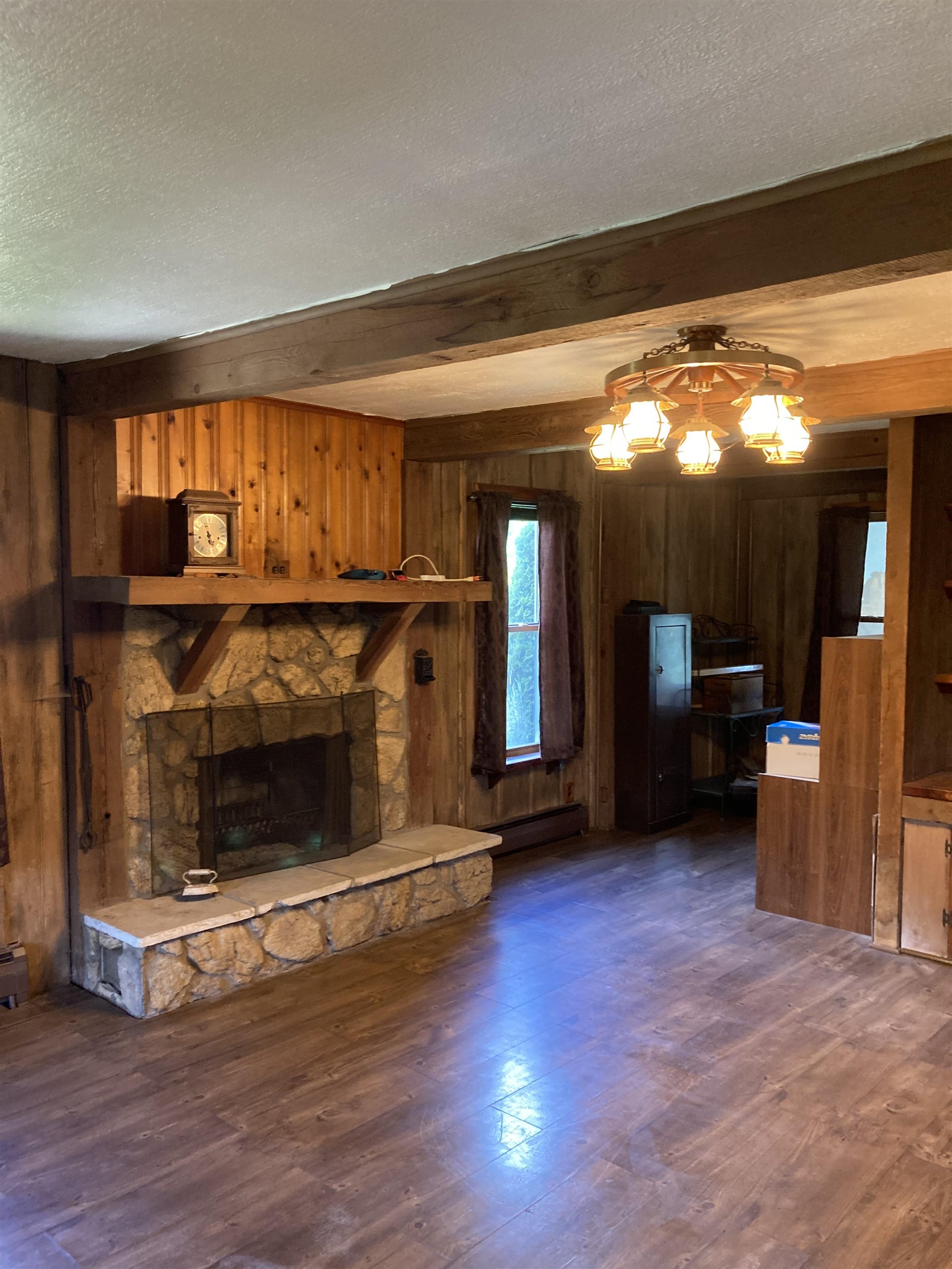 17850 Caledonia Road Caledonia, IL 61011 - Photo 15 of 20 a living room with stainless steel appliances wooden floor and a fireplace
