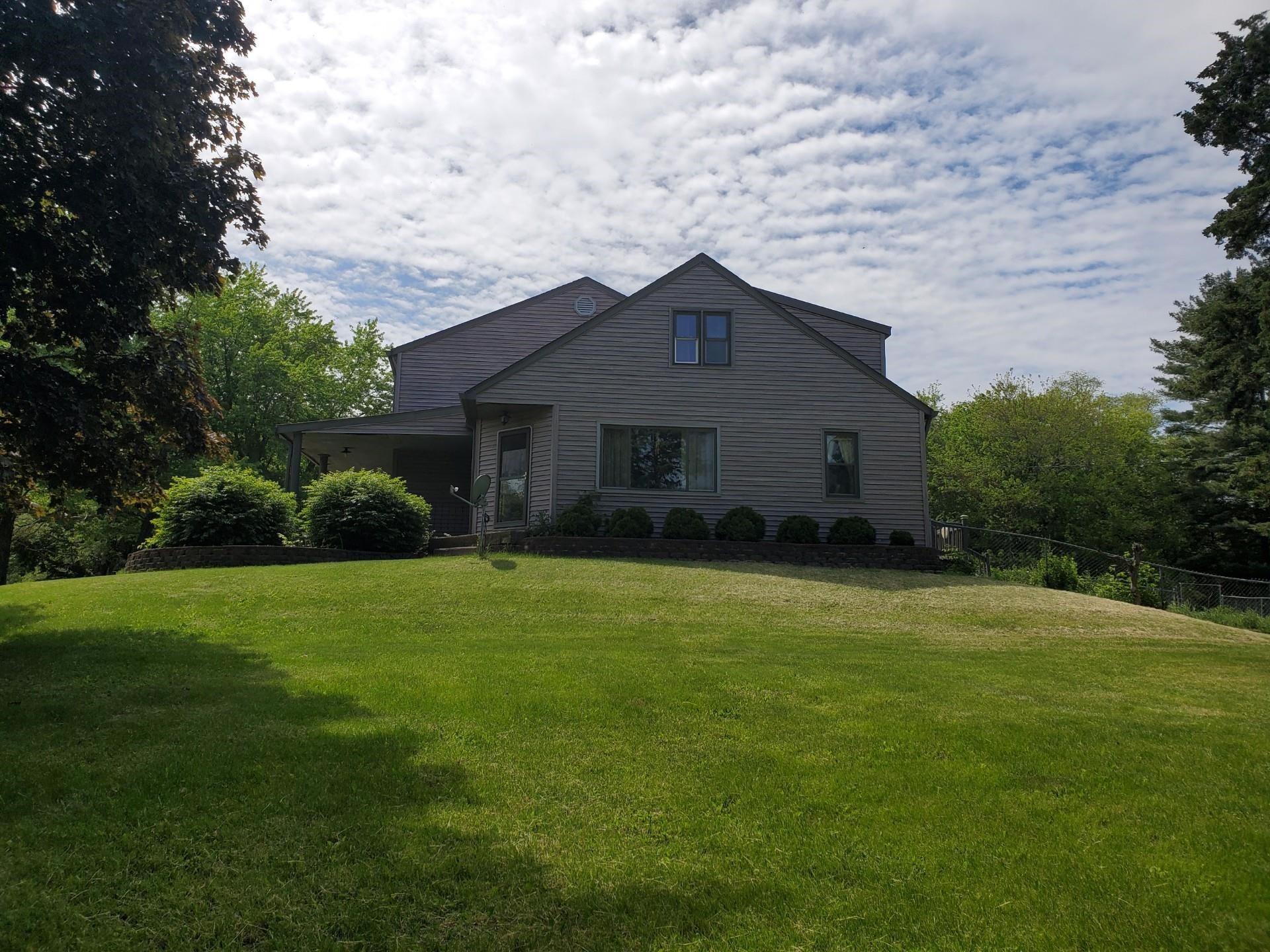 17850 Caledonia Road Caledonia, IL 61011 - Photo 2 of 20 a house view with a garden space