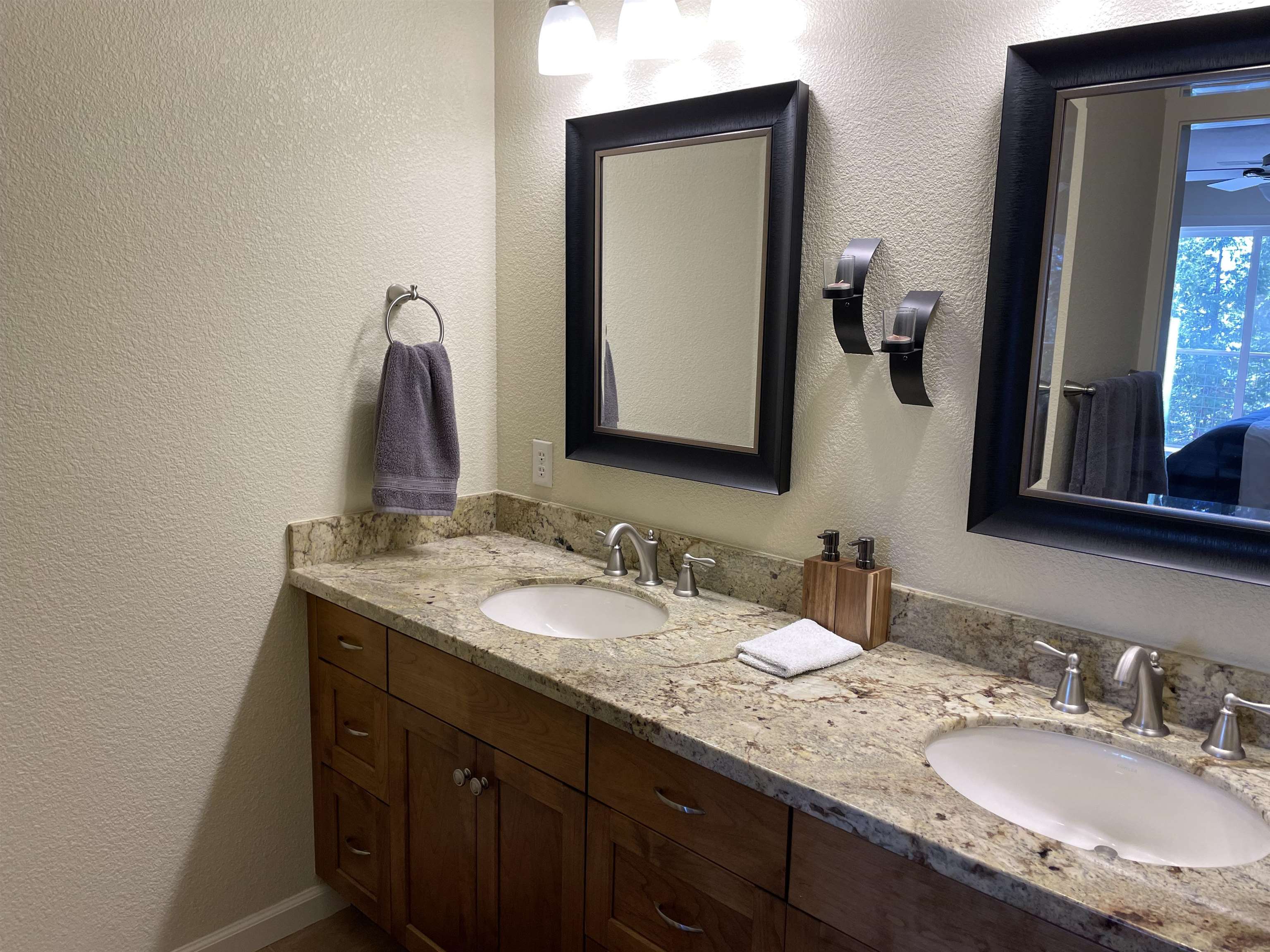 831 Timber Ridge Road Lake Almanor, CA 96137 - Photo 17 of 36 a bathroom with a granite countertop sink and a mirror