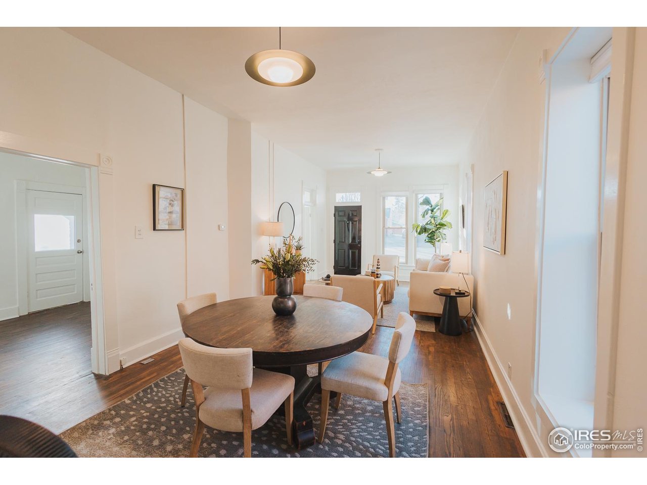 506 South Howes Street Fort Collins, CO 80521 - Photo 11 of 37 a view of a dining room with furniture and wooden floor